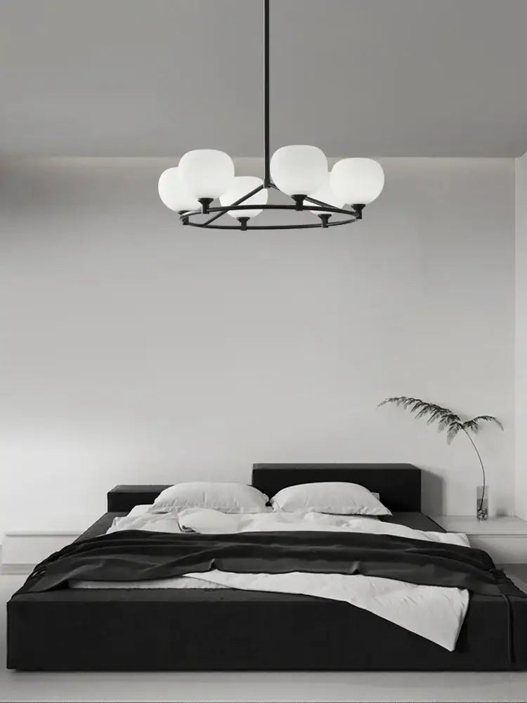 Minimalist black metal decorbites glass lampshade chandelier with six frosted globe lights for dining room decor