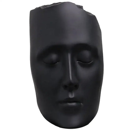 Minimalist black matte abstract face sculpture with serene expression and gold accents for living room decor