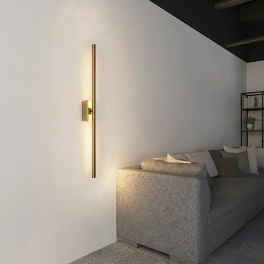Minimalist black nordic led wall sconce with gold-toned sleek vertical bar design for modern living room decorbites decor