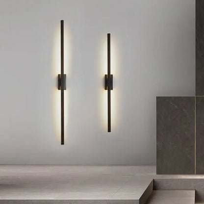 Two minimalist black nordic led wall sconces with matte finish emit warm light for elegant decorbites black nordic decor