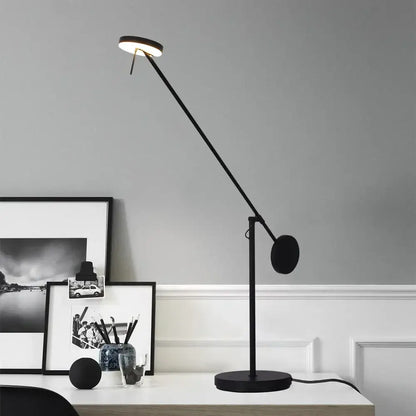 Minimalist black industrial swing arm table lamp with circular head and adjustable arm for bedroom decorbites industrial swing