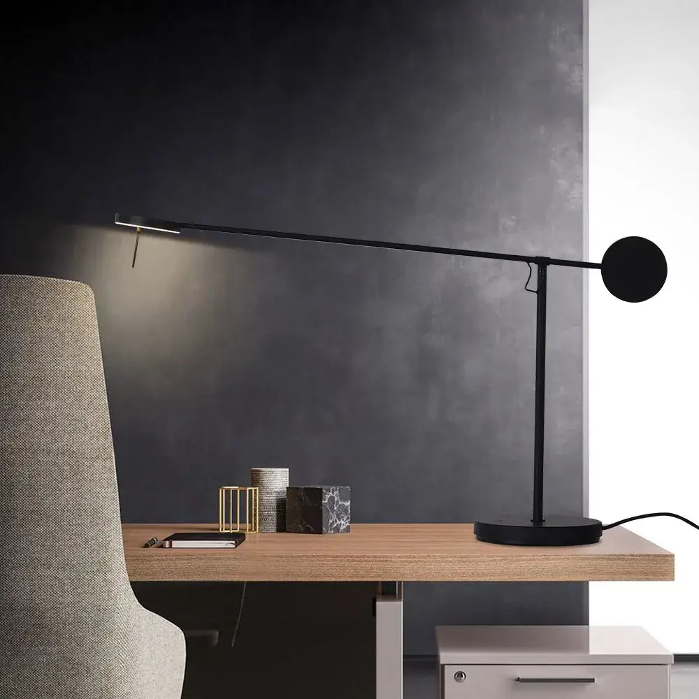 Minimalist black industrial swing arm table lamp with circular head and slender arm for bedroom decorbites industrial swing