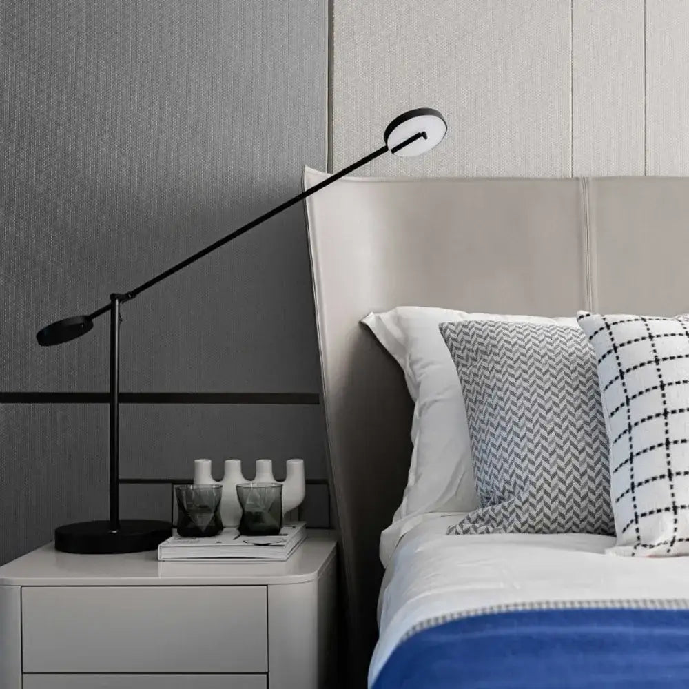 Minimalist black industrial swing arm table lamp with sleek adjustable arm and circular light heads for bedroom decorbites industrial swing