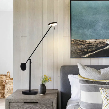 Minimalist black industrial swing arm table lamp with a sleek articulated arm and circular head for bedroom decorbites industrial swing