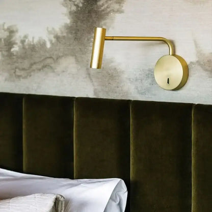 Gold-finished wall-mounted reading lamp with sleek articulated arm complements minimalist black enna led dimmable floor lamp