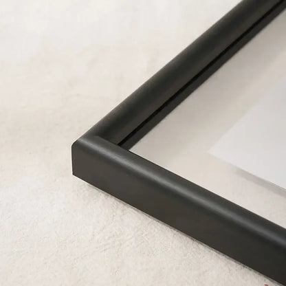 Black matte-finished minimalist mademoiselle hangable picture frame corner with sleek modern design for bedroom art