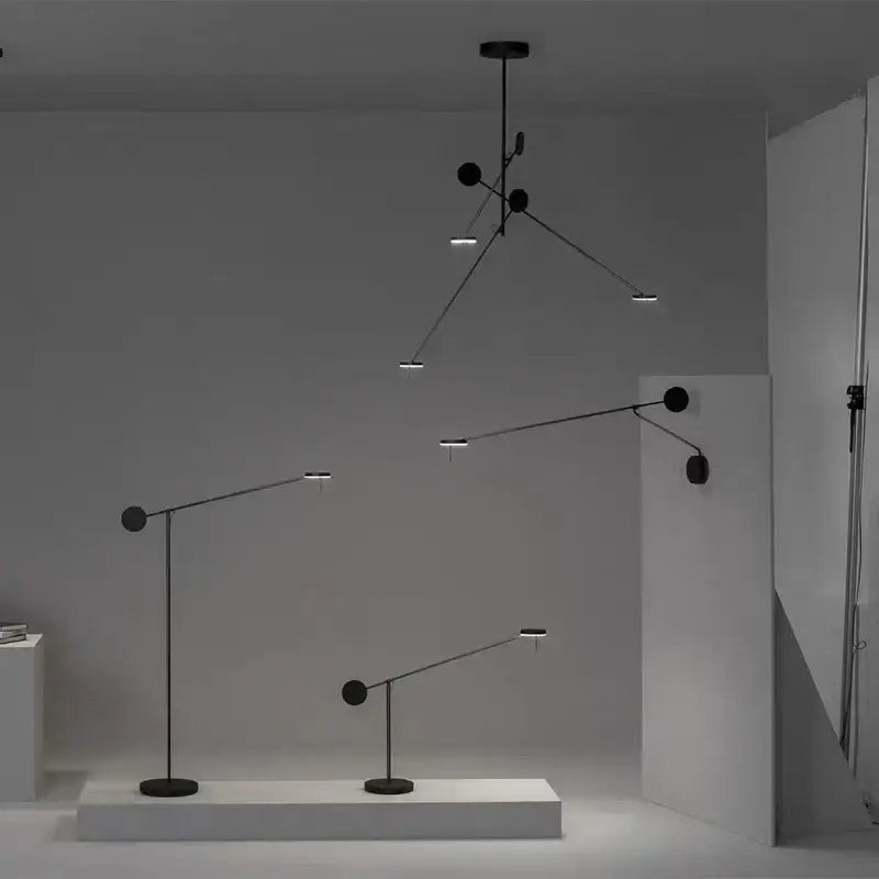 Minimalist black metal pendant light and wall-mounted led fixtures with articulated arms for living room decorbites black metal