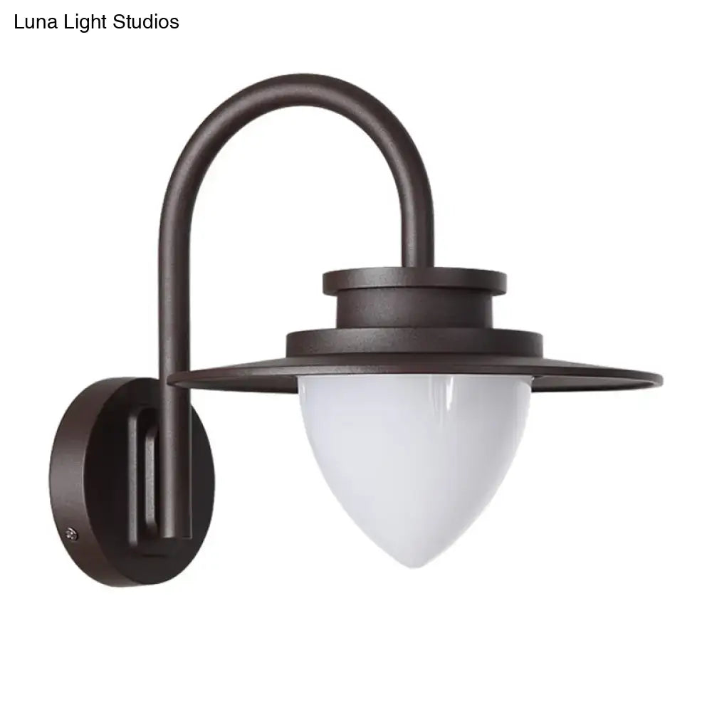 Dark bronze-finished wall-mounted lantern with frosted glass shade and maximum bulb wattage of 60w for outdoor use