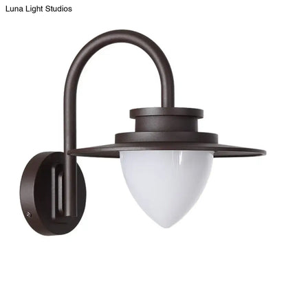 Dark bronze-finished wall-mounted lantern with frosted glass shade and maximum bulb wattage of 60w for outdoor use