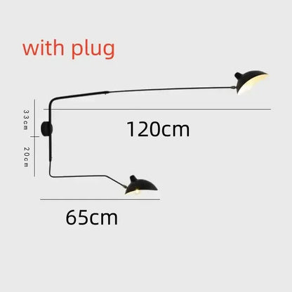 Black minimalist metal pendant light with two adjustable arms designed for dining table illumination