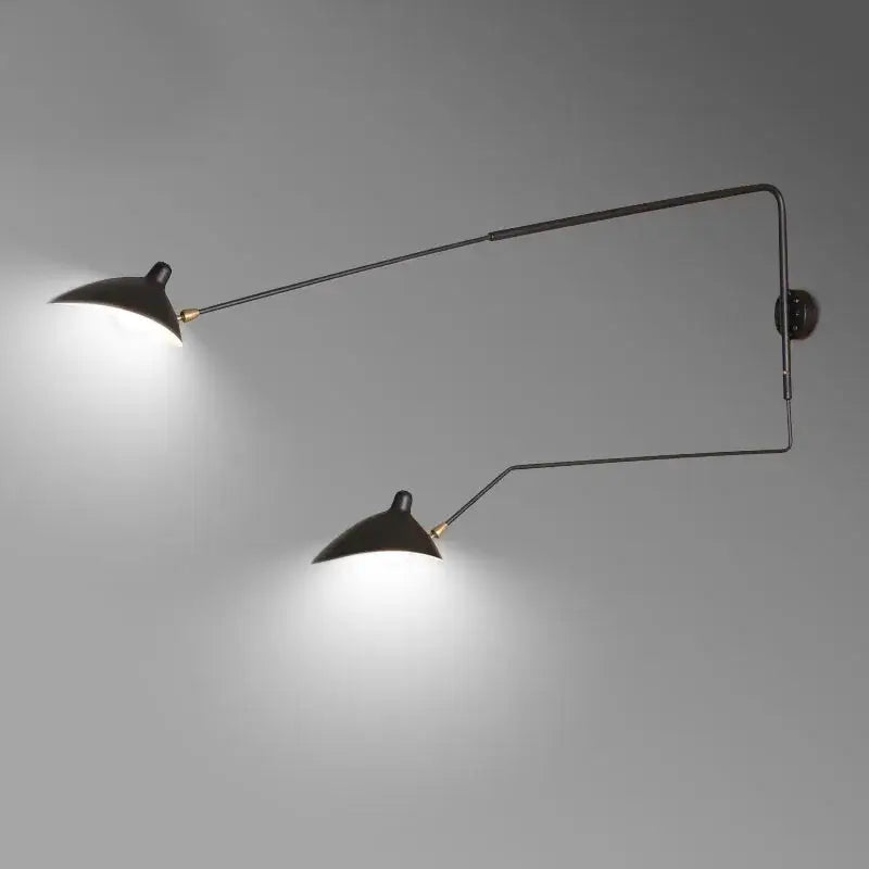 Black matte metal finish pendant light with two adjustable arms and conical shades for dining table use