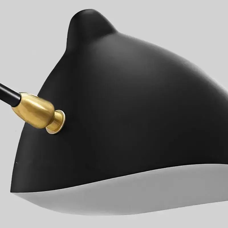 Minimalist black metal pendant light with matte black lampshade and gold-toned joint for dining table use
