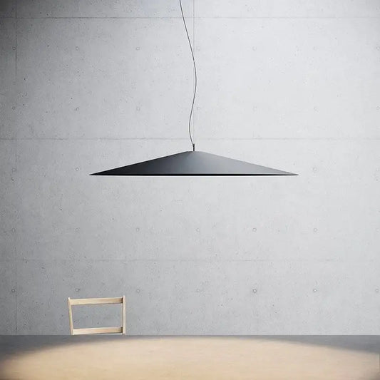 Minimalist black pendant light with sleek conical design and polished metal finish suspended by thin cord