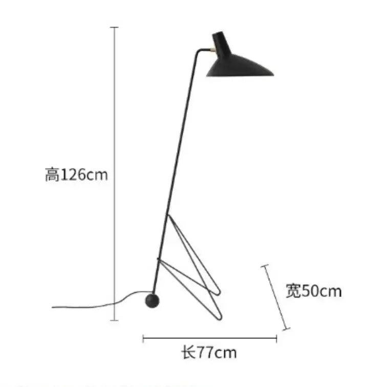 Minimalist black metal tripod desk lamp with sleek angular design and curved arm for bedroom or office use