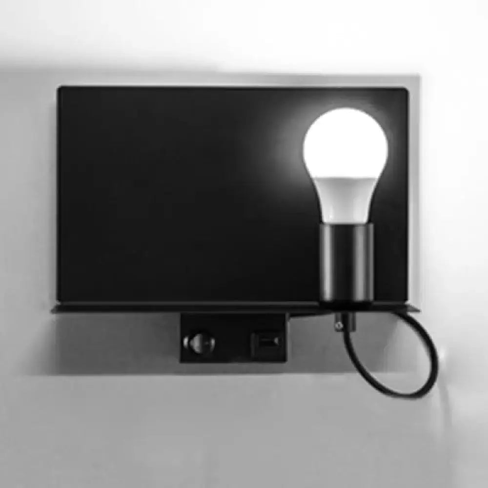 Black minimalist metal wall light with rectangular base and metal supporter featuring an exposed led bulb
