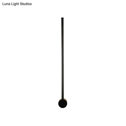 Black matte metal floor lamp with cylindrical shaft and circular base for 110v-120v wall light bulb base use
