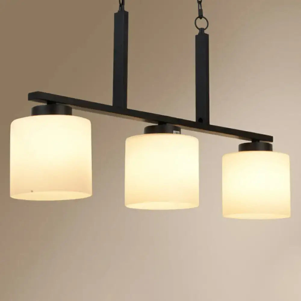 DecorBites minimalist opal frosted glass island lighting fixture with black metal frame and three cylindrical shades