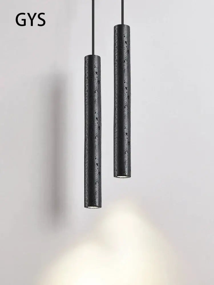 Minimalist black stone tube led pendant light with textured concrete finish for bedroom lighting decorbites black stone