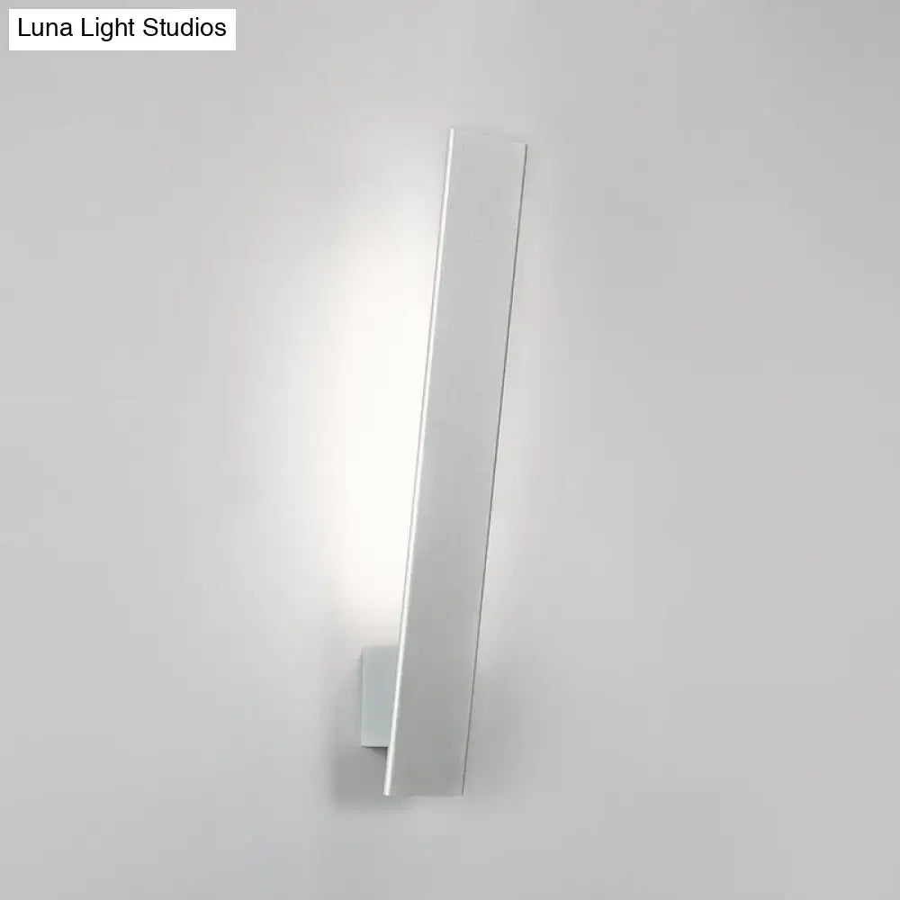 Minimalist white rectangular wall sconce with aluminum shade and direct wired design for modern bedroom use