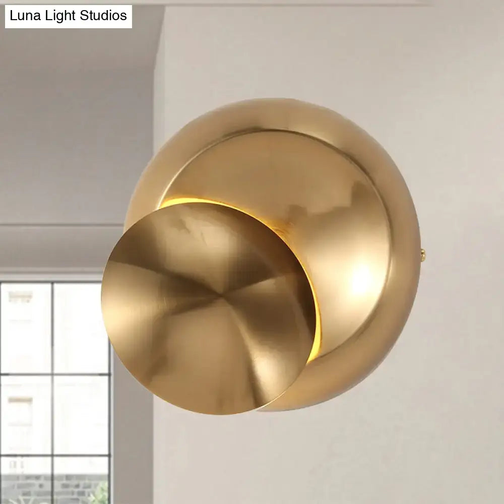 Gold-toned minimalist wall lamp with sleek overlapping circular design in black white for stairway inch fixture