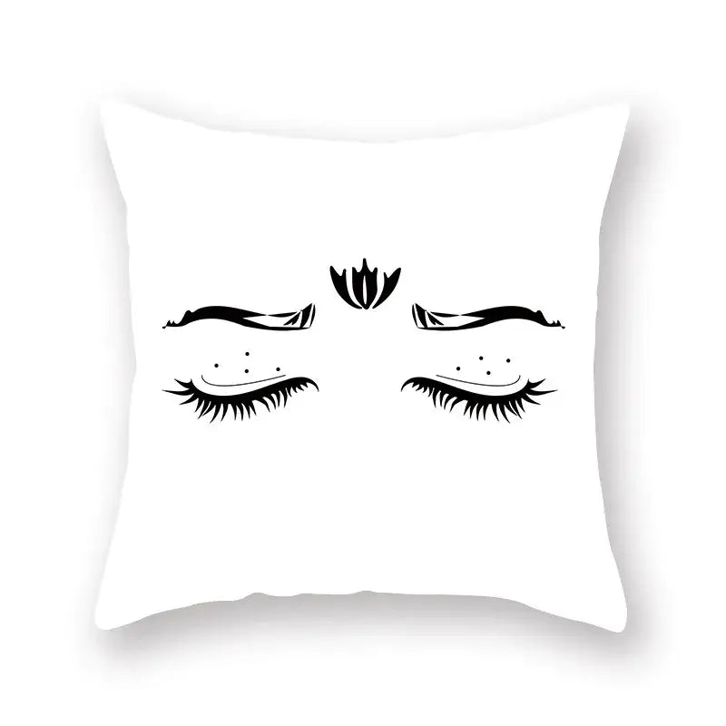 White square pillow with black minimalist graphic of closed eyes and lotus flower decorbites black geometric cushion cover