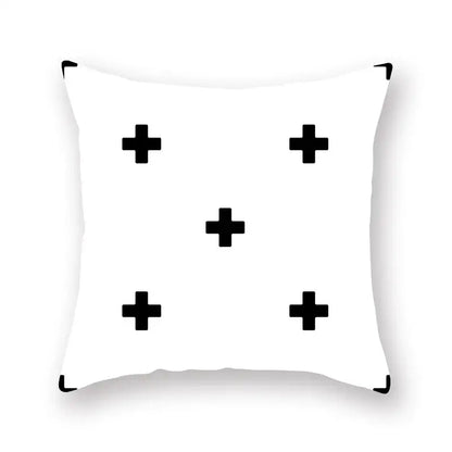 White throw pillow with minimalist black geometric cushion cover featuring five bold plus signs for living room decorbites black geometric style