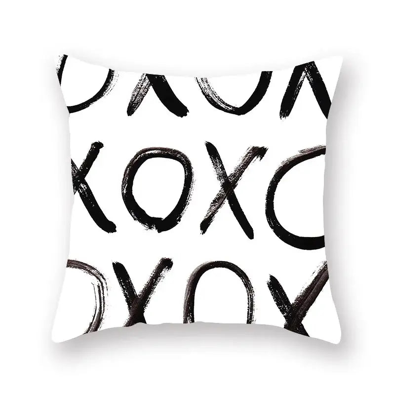 White throw pillow with bold black brushstroke xoxo pattern minimalist black geometric cushion cover for living room decor