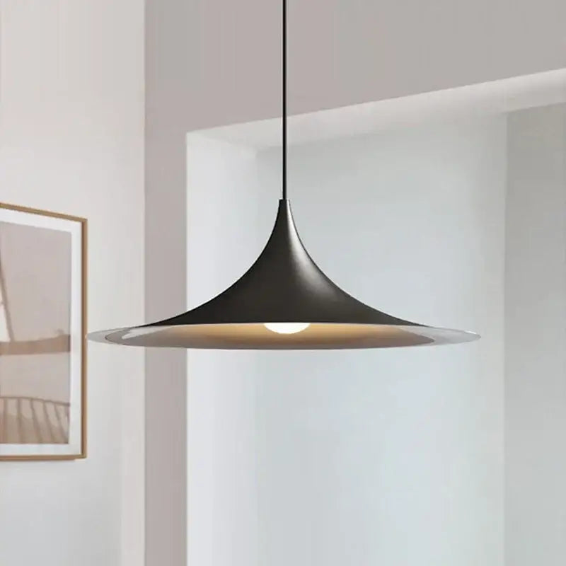 Minimalist black matte pendant light with warm-toned interior for dining room cord pendant installation color options