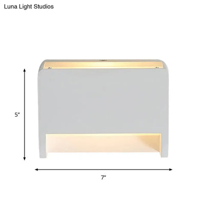 Minimalist box shape white wall mounted paper towel dispenser with modern white light fixture and warm led illumination