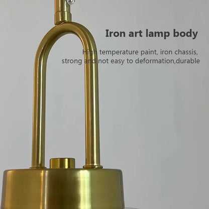 Minimalist brass-finished iron art pendant light body with clear glass and u-shaped design for cord pendant installation