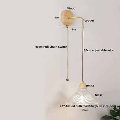 Minimalist wall light with natural wood base copper arm clear glass shade and adjustable 70cm wire decorbites clear glass