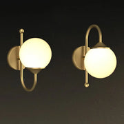 Minimalist brass led wall lamp with frosted glass globe shades for dining room lighting