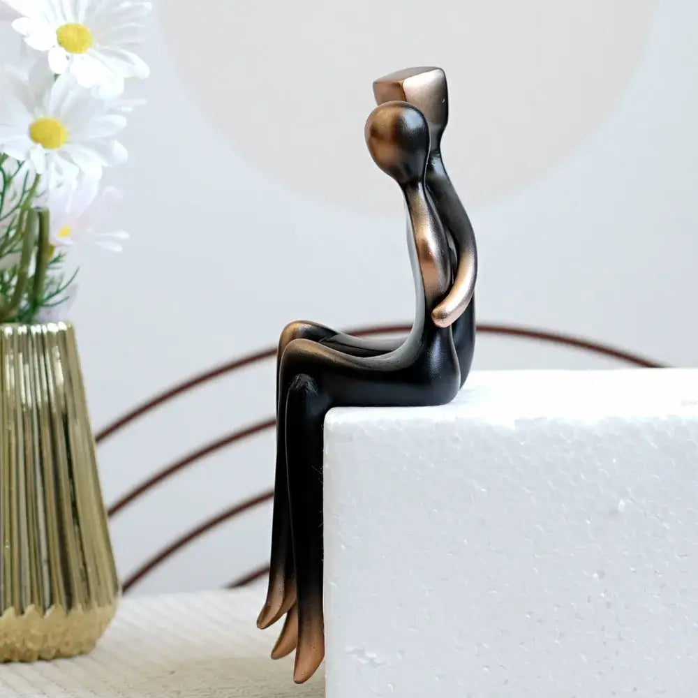 Bronze and black abstract resin couple sculptures featuring two stylized figures embracing for elegant decorbites decor