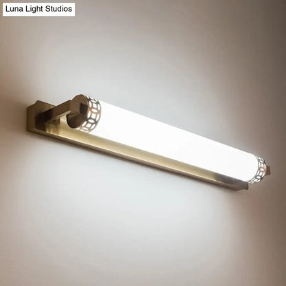 Minimalist bronze wall light sconce with brushed brass finish frosted glass diffuser and ornate lattice detailing for bathroom vanity