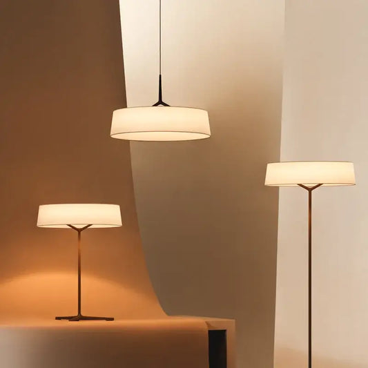 Minimalist bronze italian design floor lamp with off-white fabric shade and slender metal frame for living room decorbites italian design