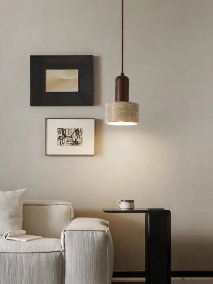 Minimalist brown and cream pendant lamp with a dark cylindrical top and textured concrete cream wind led shade