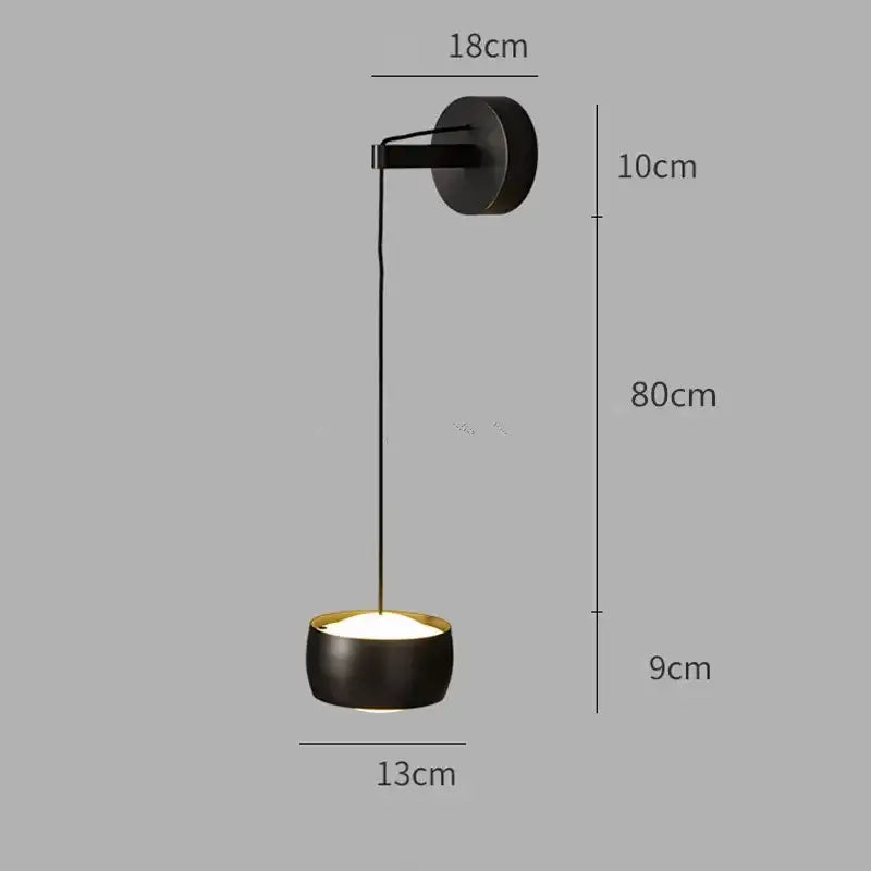 Minimalist wall lamp with black matte cylindrical shade and brushed gold trim ideal as a bedroom reading light decorbites copper adjustable