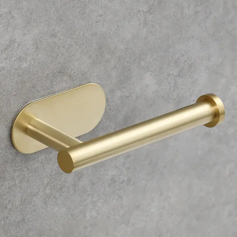 Minimalist brushed gold stainless steel tissue holder with sleek cylindrical design and brushed metal finish for bathroom use