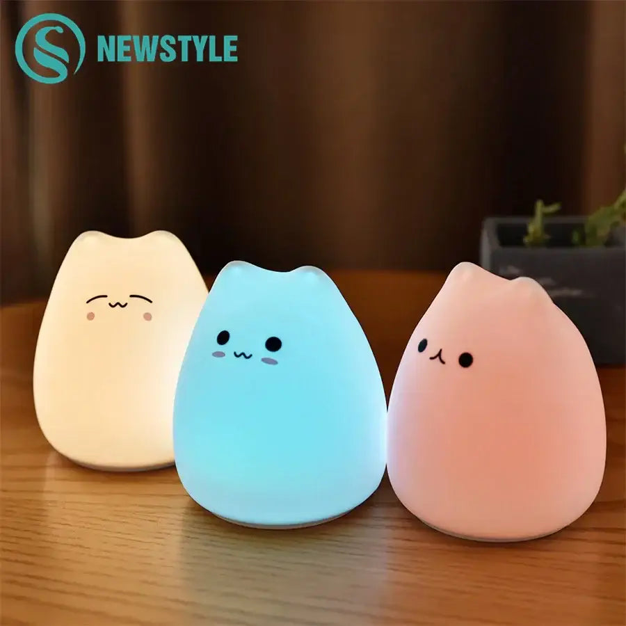 Three minimalist cat silicone led night lights in cream blue and pink for bedroom decorbites cat silicone night light