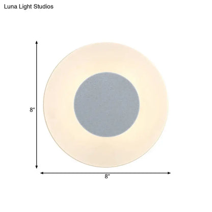 Minimalist circular led wall lamp with soft beige outer ring and gray center panel by luna light studios for living room