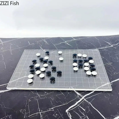 Clear acrylic go board with black and white stones as a minimalist decorbites geometric chess set for living room decor