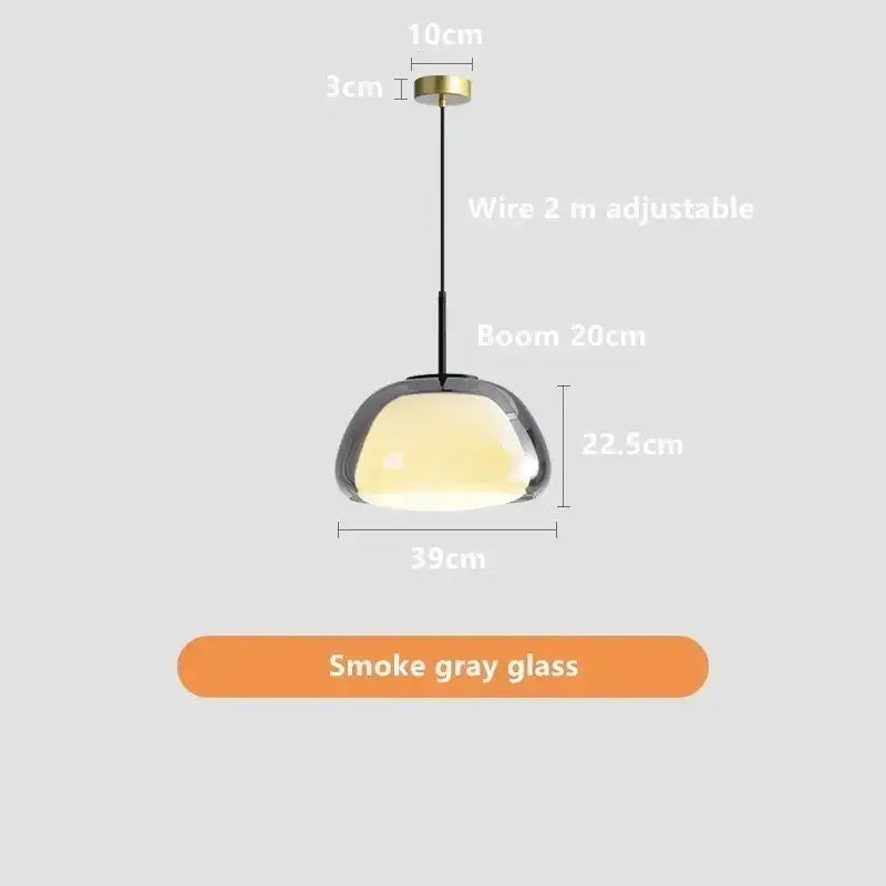 Minimalist jelly pendant lamp with sleek smoke gray glass shade and brass ceiling mount for living room lighting