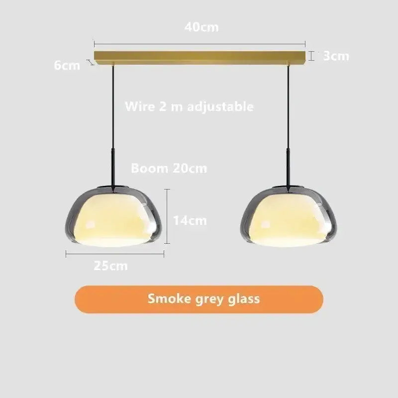 Modern minimalist jelly pendant lamp featuring smoke grey glass shades and brass-finished bar for living room lighting
