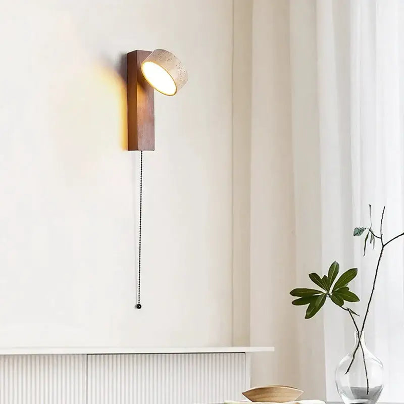 Minimalist concrete and wood led light wall lamp with warm wooden base textured concrete shade and black pull chain decorbites cream style