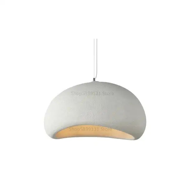 Minimalist concrete cobblestone pendant lights with matte white ceramic dome and warm LED glow for dining room decorbites