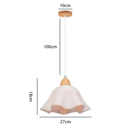 A minimalist crisp white ceramic pendant light with fluted shade and wood accents for kitchen island lighting