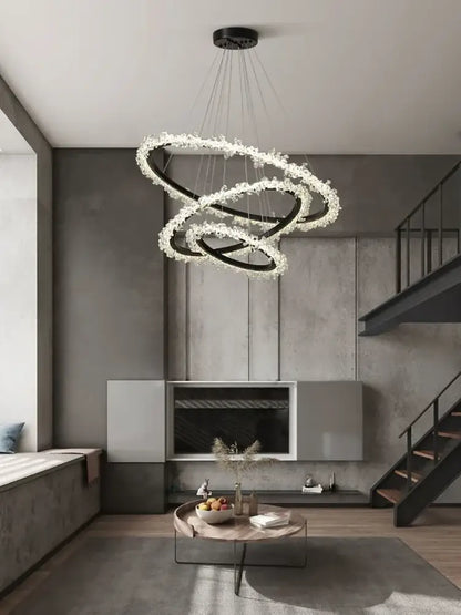 Minimalist crystal gold black ring chandelier with spiral black metal rings and white crystal accents for dining room decorbites
