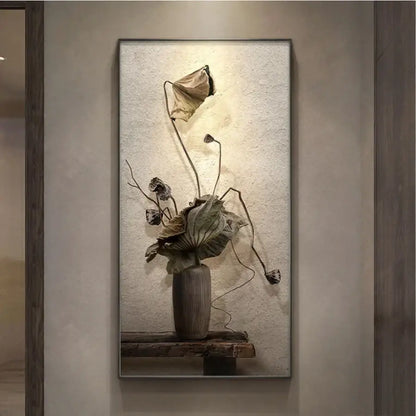 A minimalist earthy led wall lamp featuring a textured dark gray ceramic vase with dried lotus leaves decor