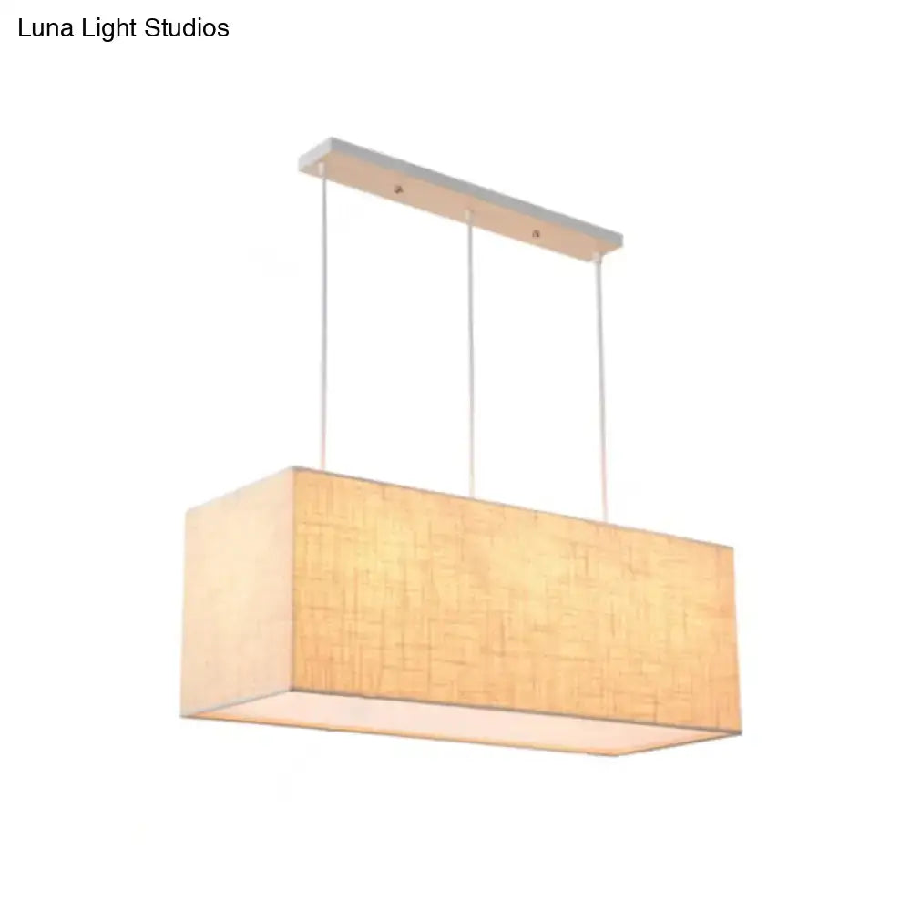 Minimalist rectangle island lighting with warm beige fabric shade and sleek silver metal ceiling mount island lighting fixture