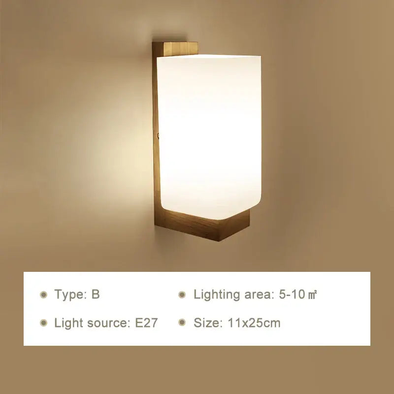 Modern rectangular wooden wall lamp with brass finish and warm frosted glass diffuser for bedroom use